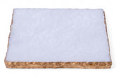 Rectangular piece of material with a white top layer and brown bottom layer on a white background