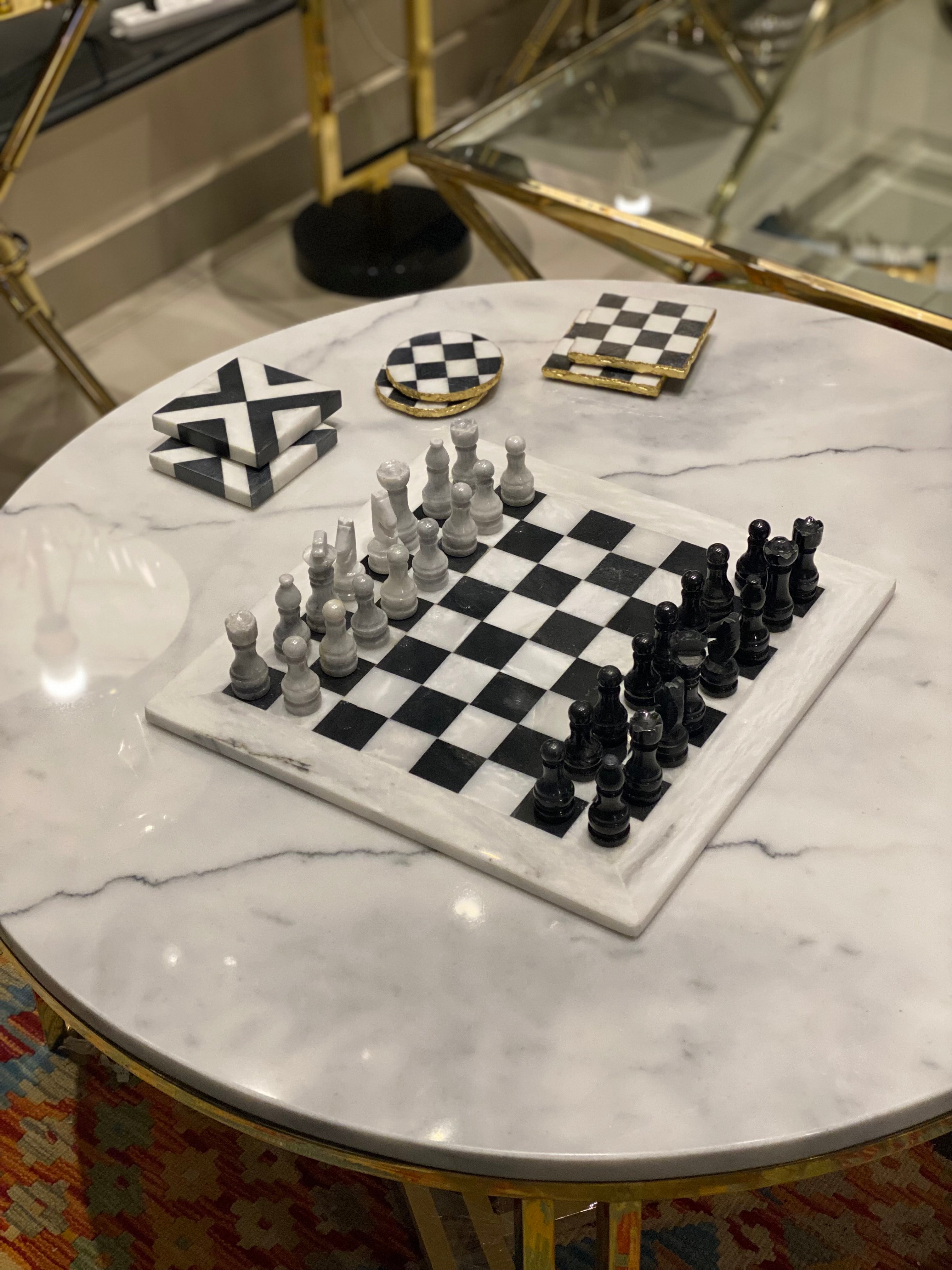Marble table with a chessboard and pieces