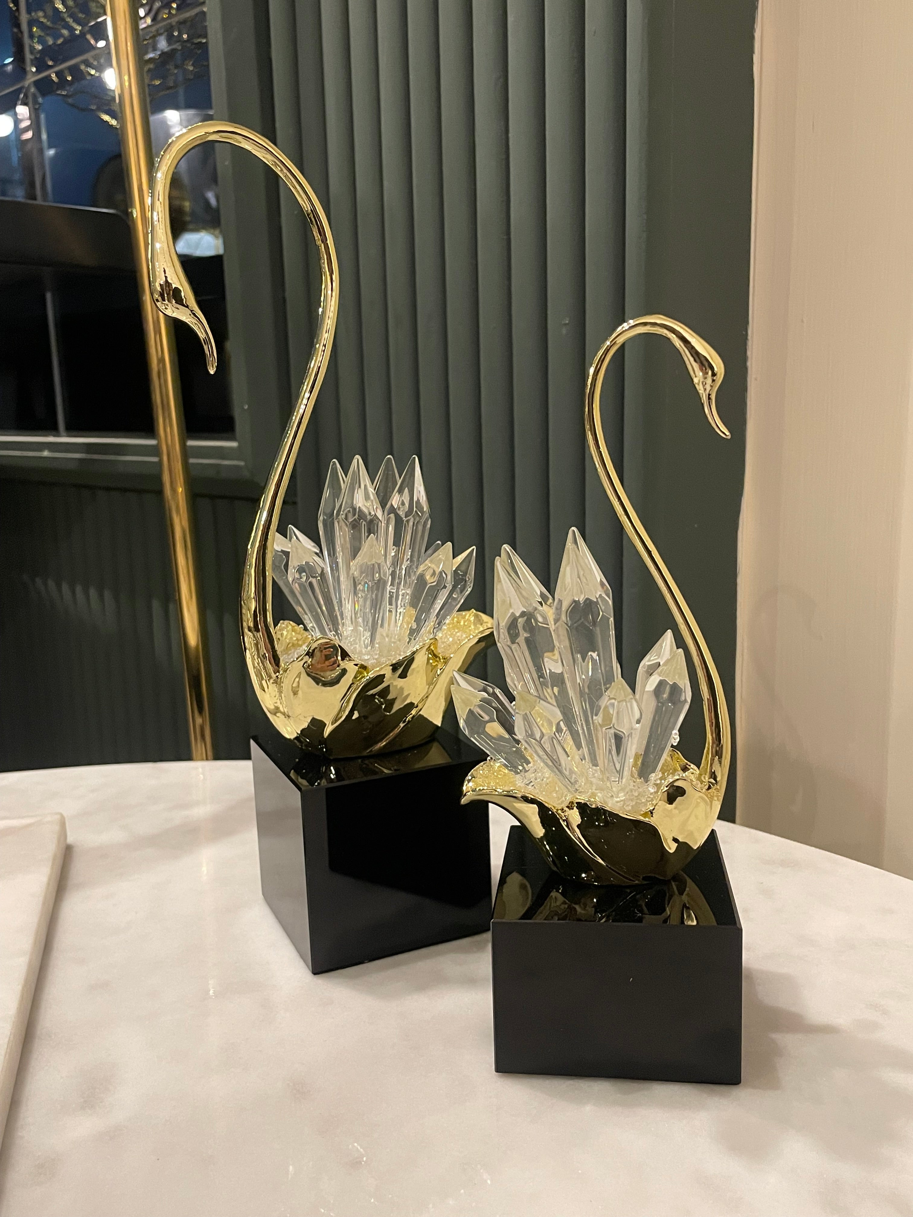 Decorative lamp with gold and clear crystal design on a black base.
