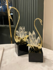 Decorative lamp with gold and clear crystal design on a black base.