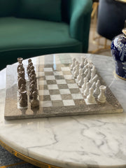 Chessboard with chess pieces on a marble table