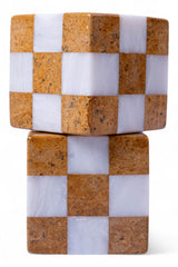 Stack of checkered stone blocks with alternating brown and white squares on a white background