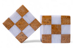 Two checkered stone coasters with brown and white pattern on a white background
