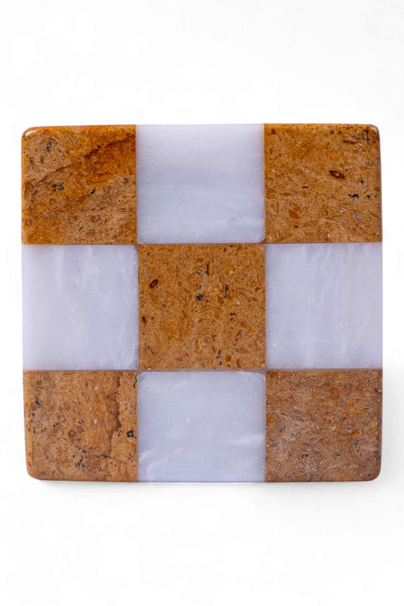 Checkered pattern coaster with brown and white squares on a white background