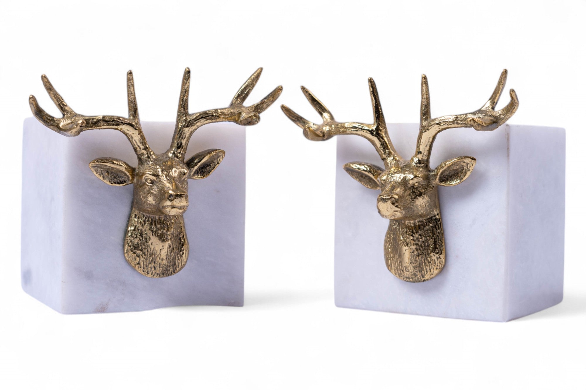 Pair of gold deer head bookends on a white background