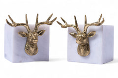 Pair of gold deer head bookends on a white background
