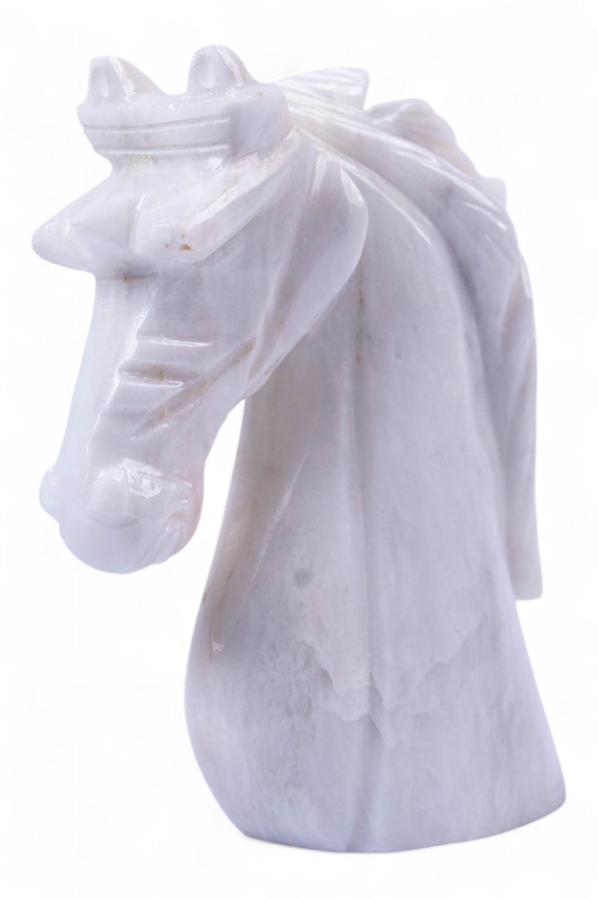 White marble horse head sculpture on a white background