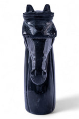 Black stone sculpture of a zebra on a white background