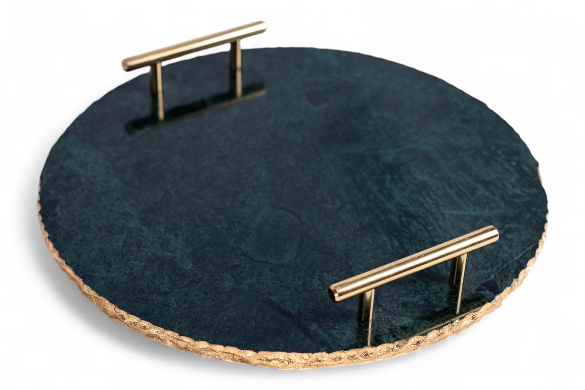 Round dark stone tray with gold handles on a white background