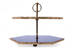 Two-tiered serving tray with marble-like finish and purple glass bottom on a white background