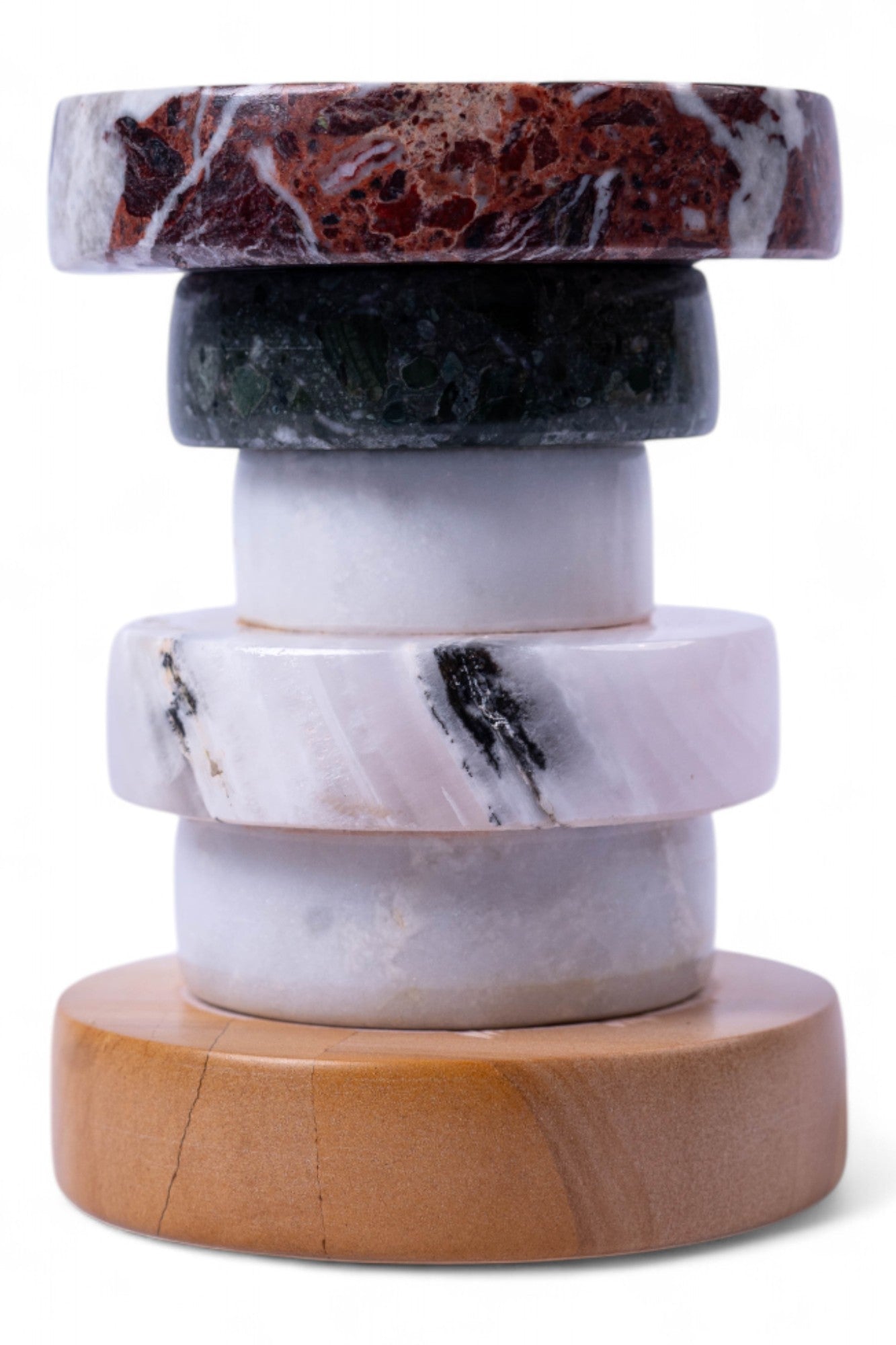 Stack of marble coasters with a wooden base on a white background