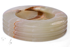 Coiled white cable with a brown swirl on a white background
