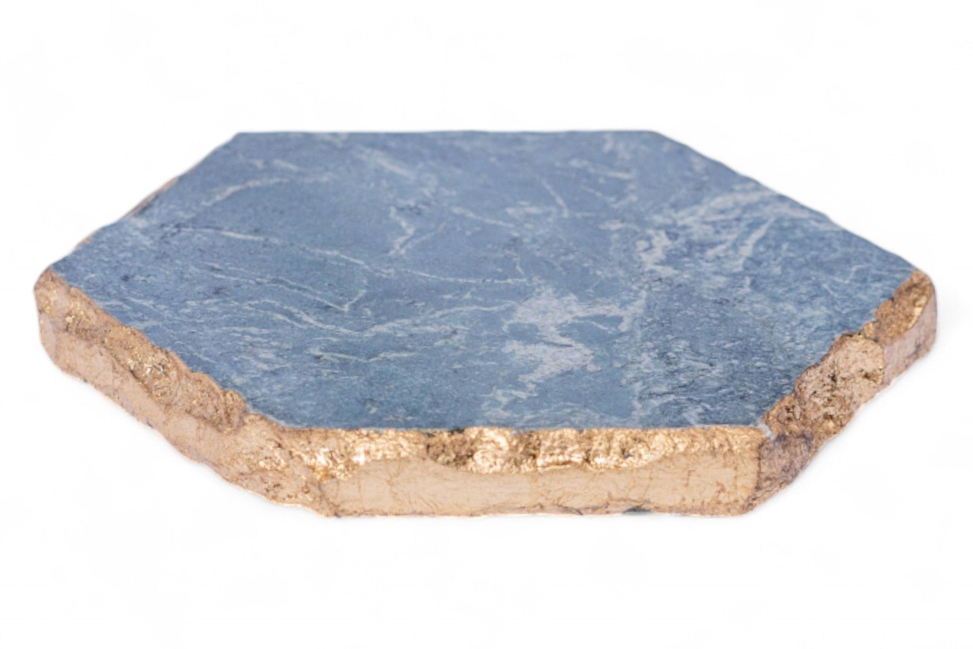 Hexagonal blue stone coaster with gold edge on a white background