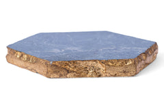 Hexagonal stone coaster with blue top and brown base on a white background