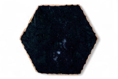 Hexagonal black stone tile on a white background