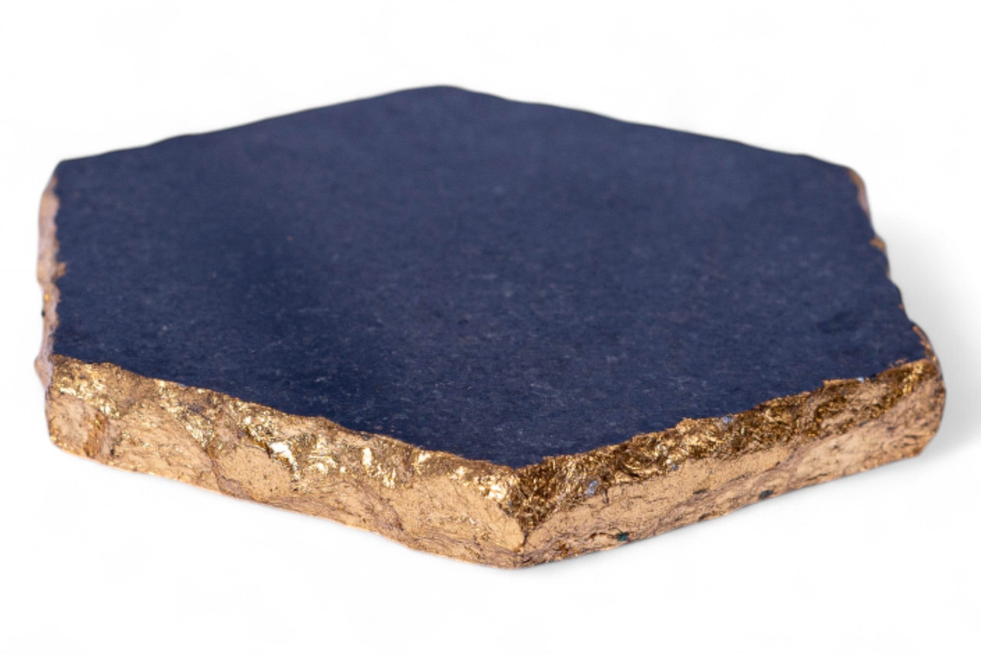 Hexagonal stone with gold base and blue top on a white background