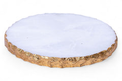Round coaster with white center and gold edge on a white background
