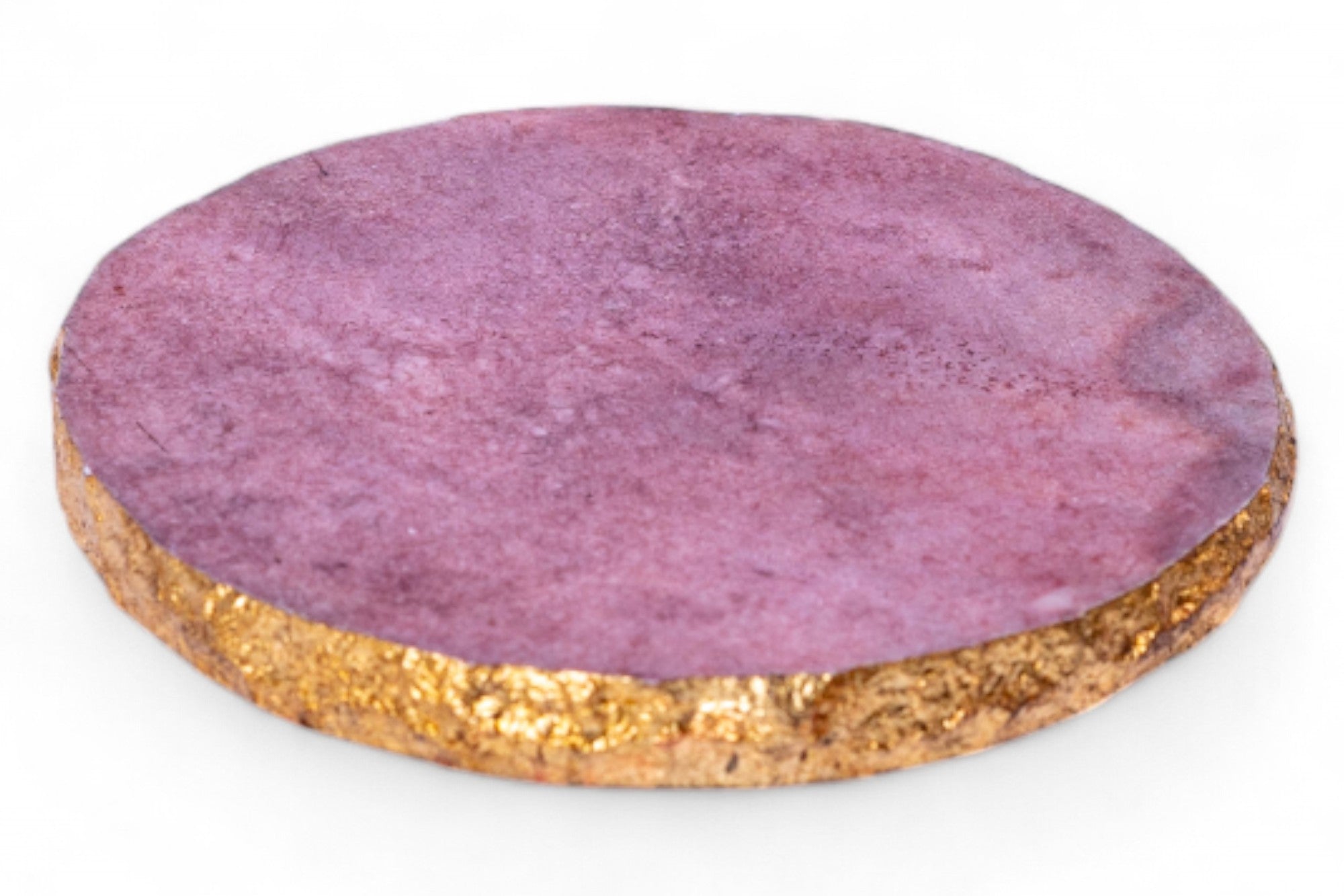 Round purple coaster with cork base on a white background