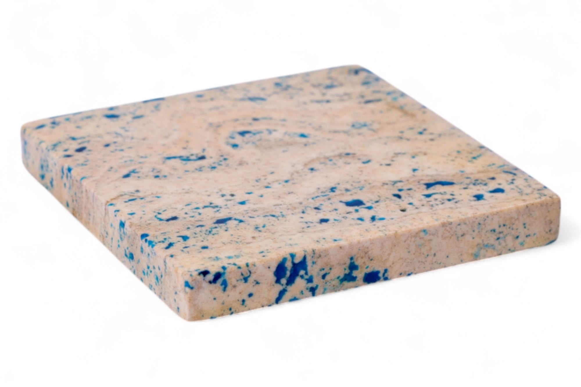 Rectangular foam block with blue speckles on a white background