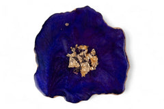 Blue decorative item with gold and black design on a white background