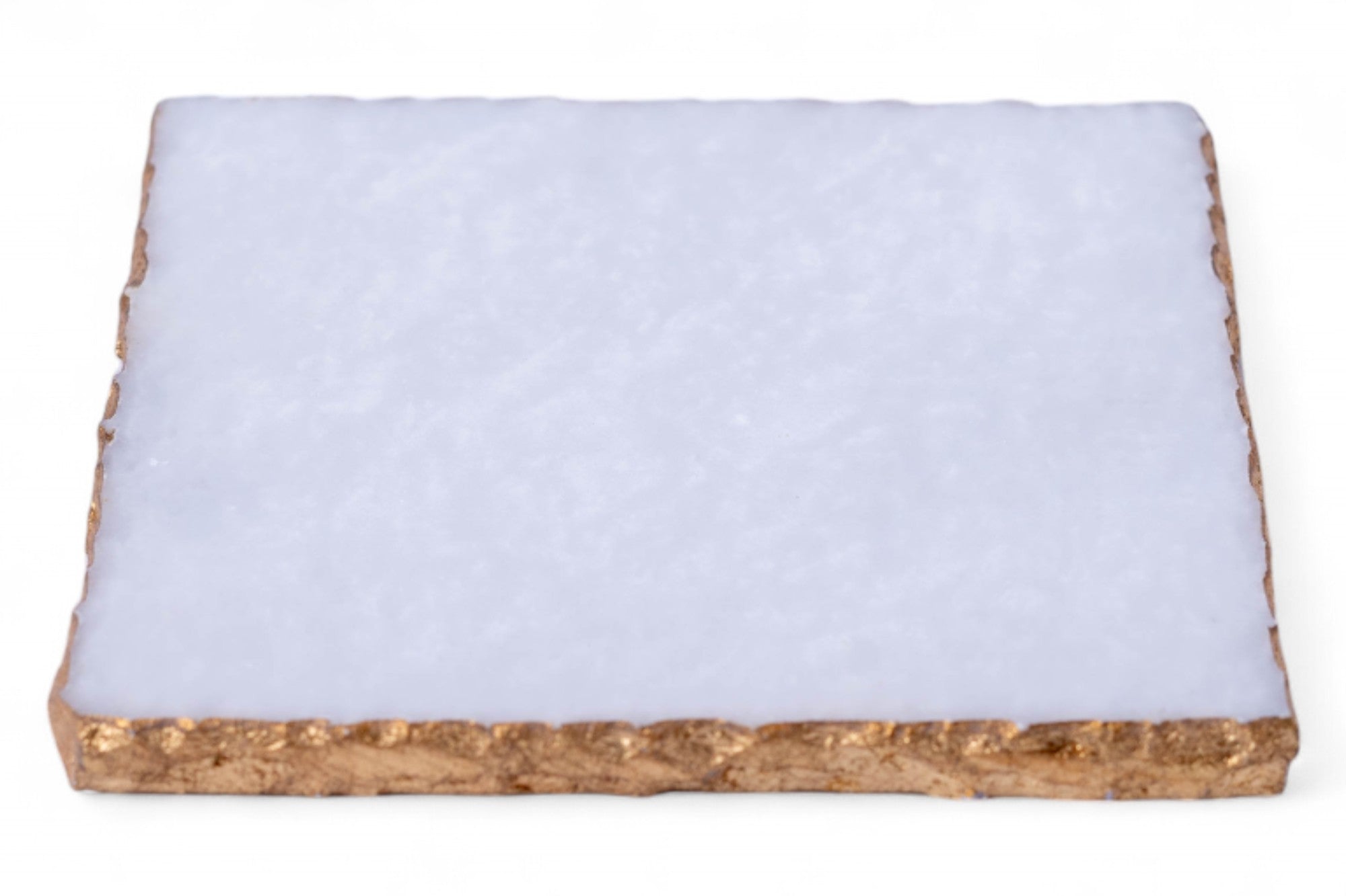 Rectangular piece of material with a white top layer and brown bottom layer on a white background