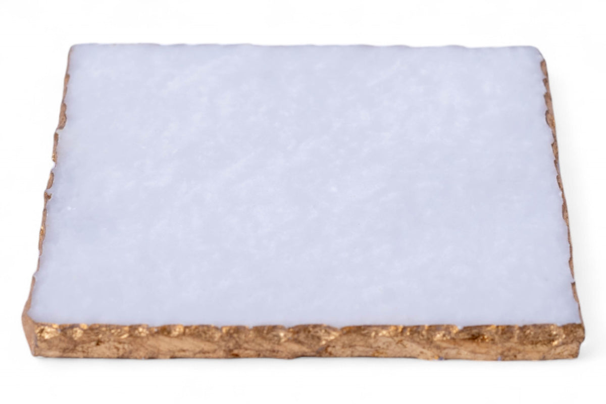 Rectangular piece of material with a white top layer and brown bottom layer on a white background