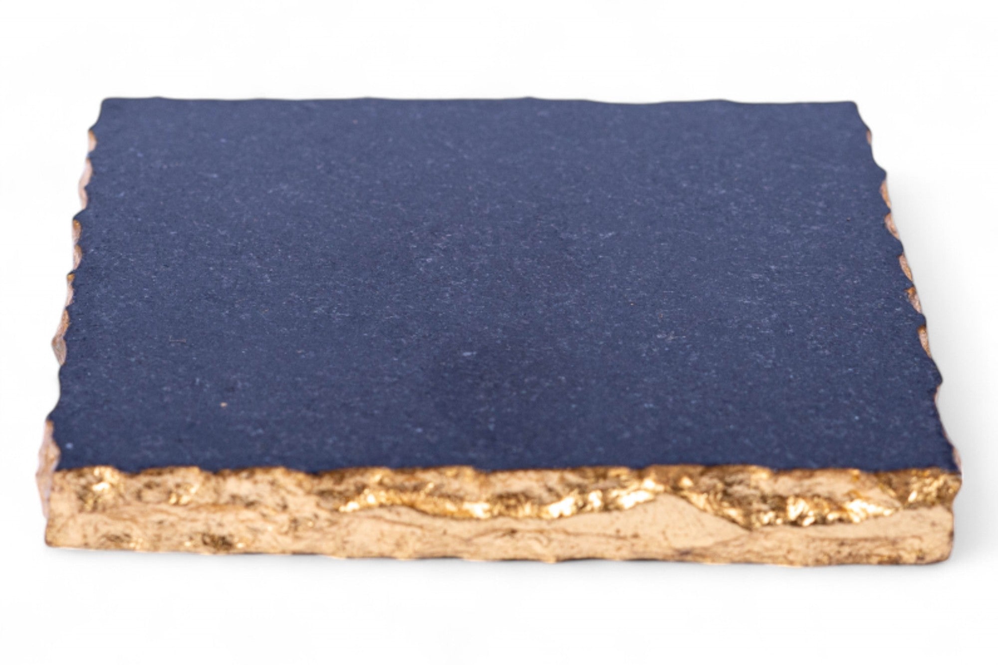 Rectangular blue stone with gold base on a white background