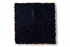 Square piece of black felt on a white background