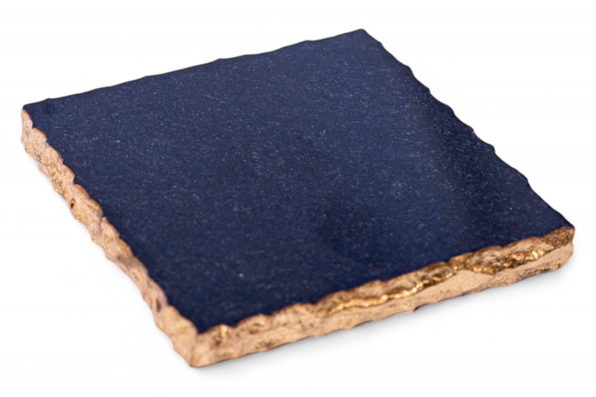 Square stone coaster with blue top and brown edge on a white background
