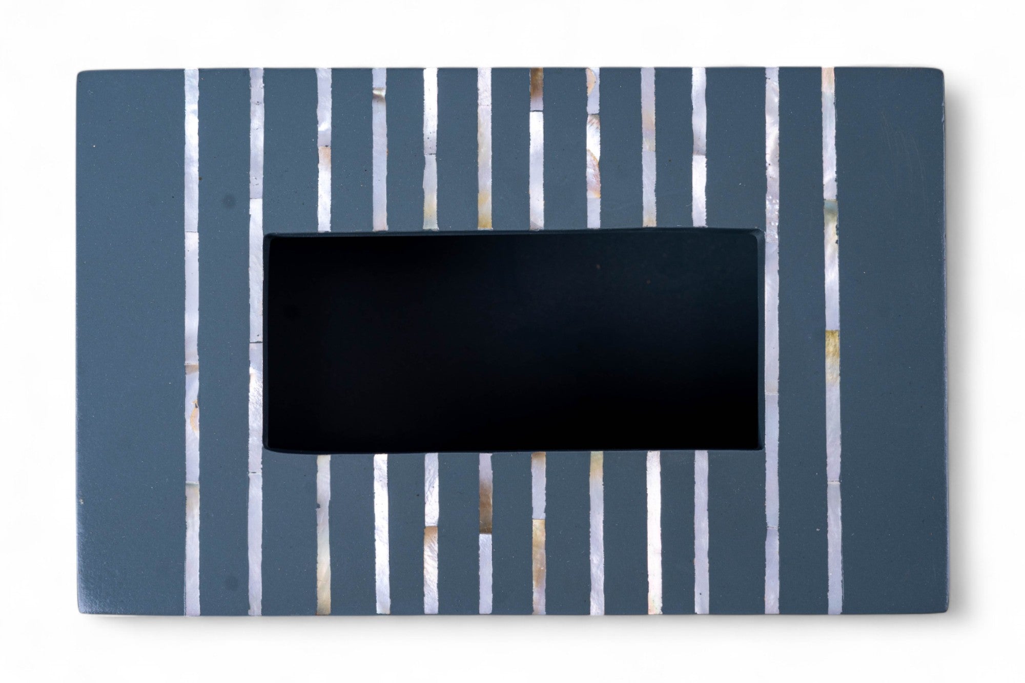 Rectangular black object with vertical blue and white stripes on a white background