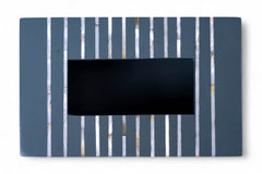 Rectangular black object with vertical blue and white stripes on a white background
