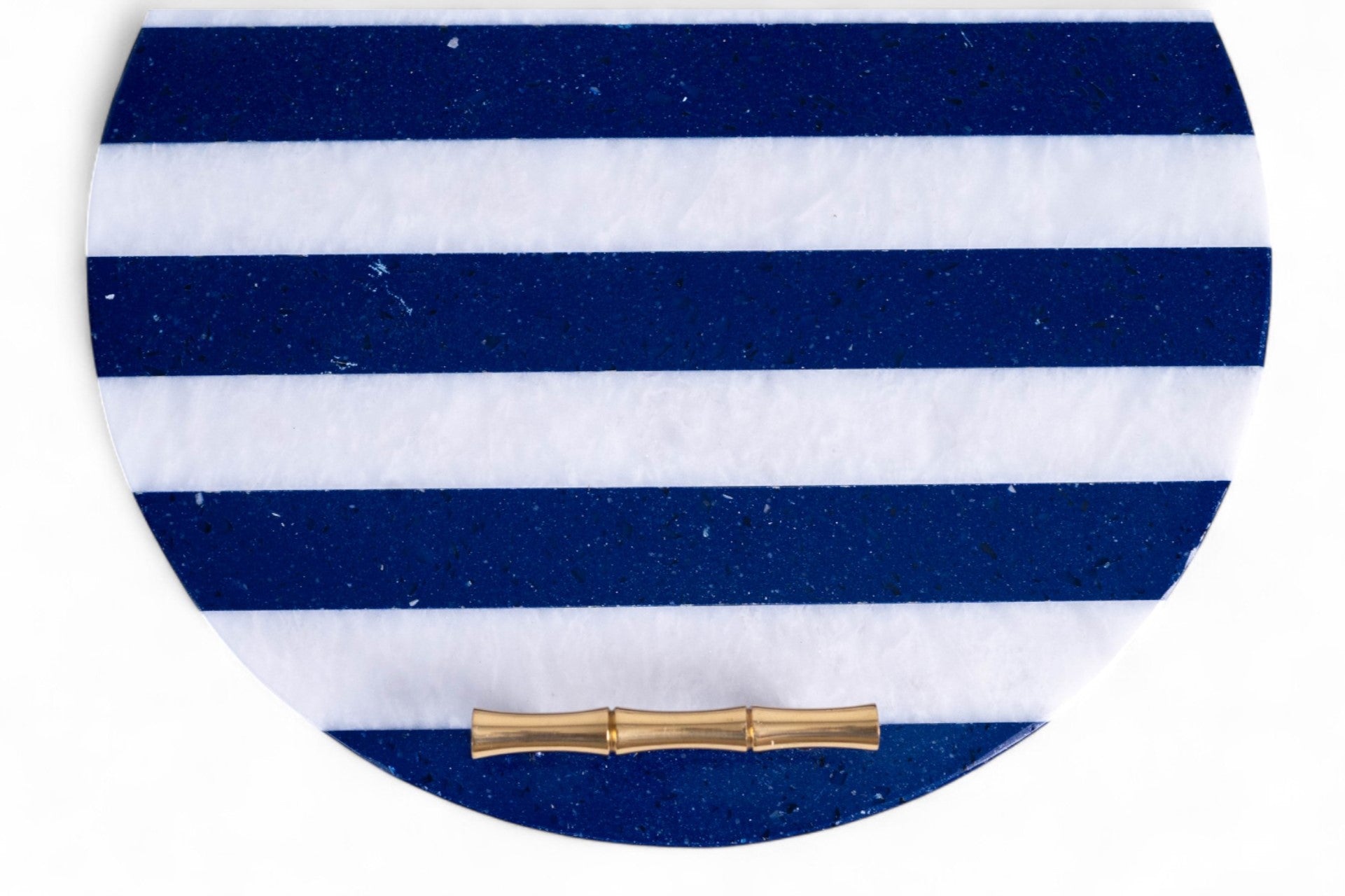 Round blue and white striped clutch with a gold clasp on a white background