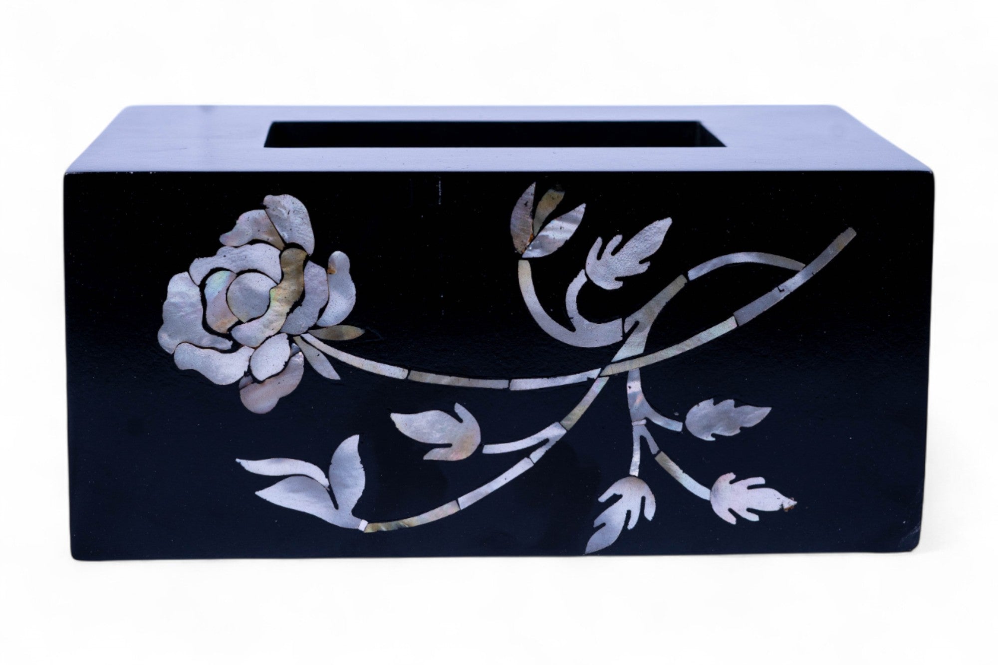 Black tissue box cover with floral design on a white background
