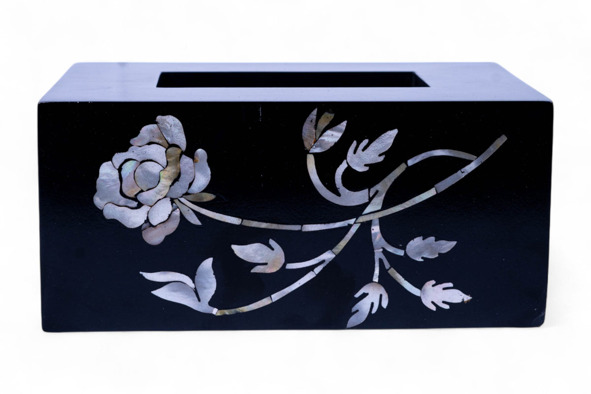 Black tissue box cover with floral design on a white background