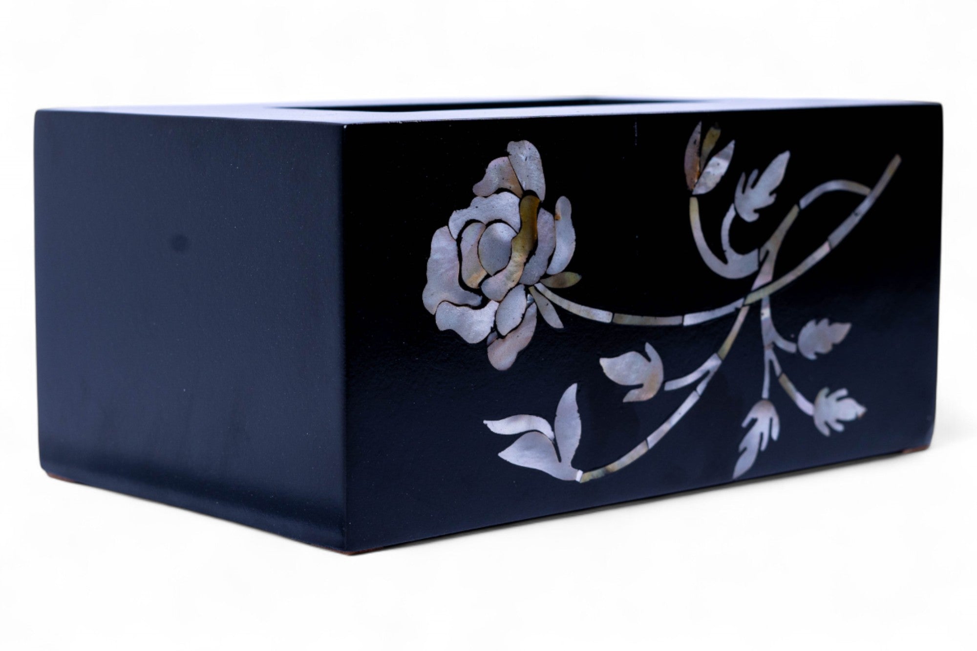 Navy blue rectangular box with floral design on a white background