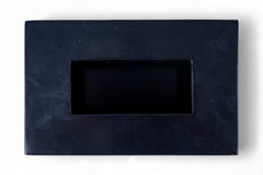 Black rectangular stone with a smaller central rectangle on a white background