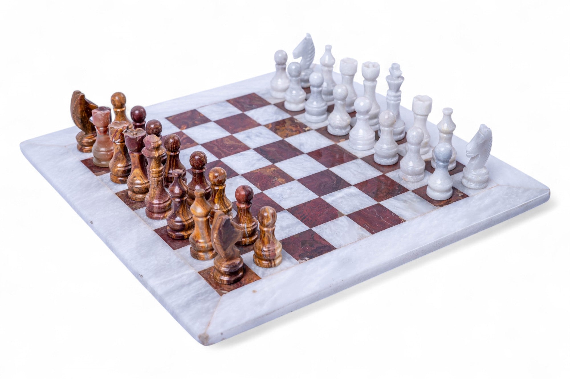 Wooden chess set with checkered board on a white background