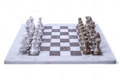 Marble chess set with white and gray pieces on a checkered board.