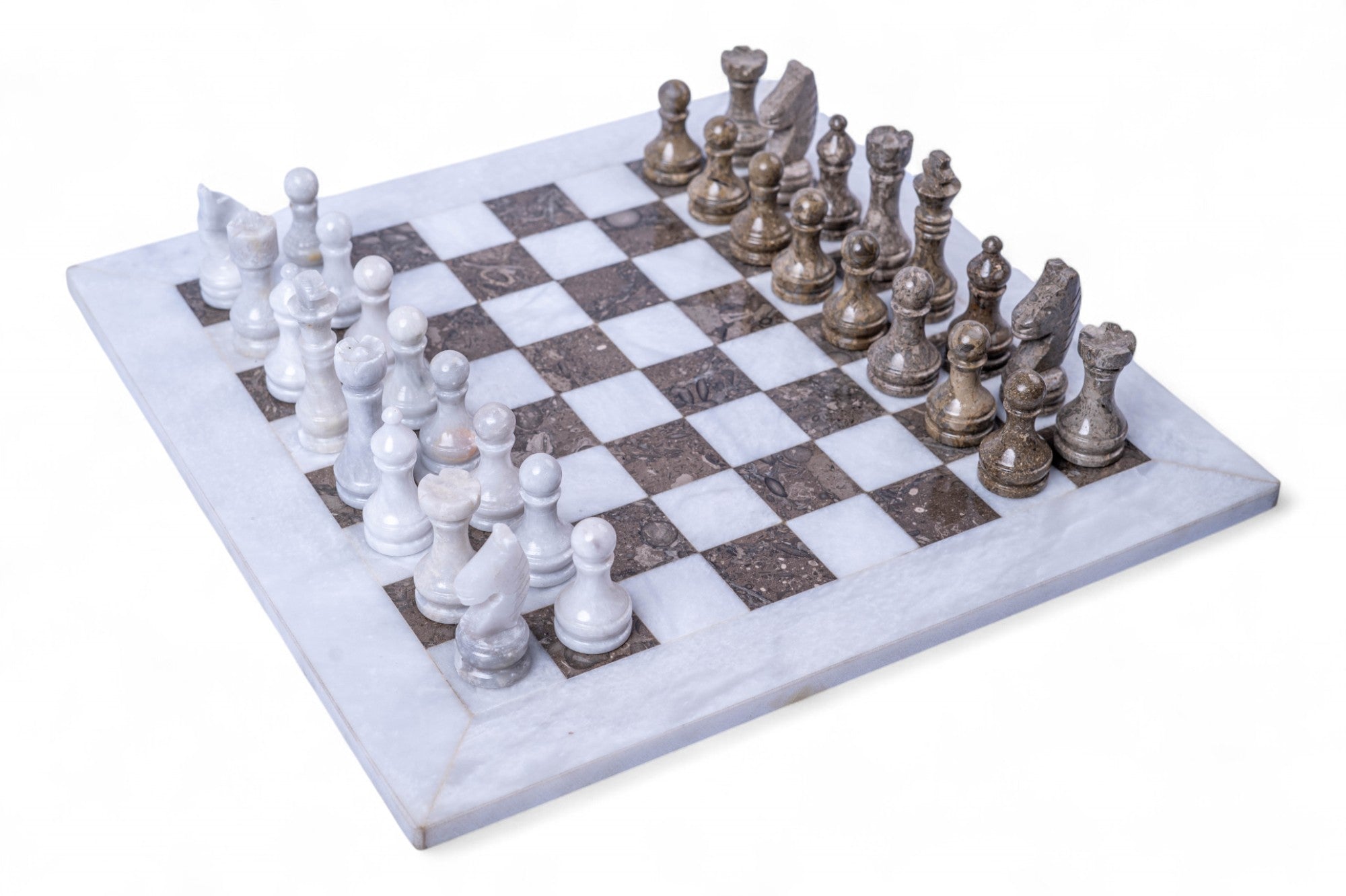 Marble chess set with white and silver pieces on a white background