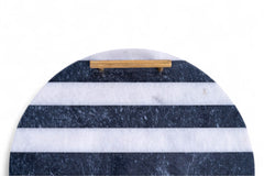 Marble cutting board with blue and white stripes and a wooden handle on a white background