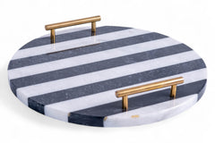Round marble tray with blue and white striped pattern and gold handles on a white background