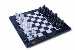 Black and white chess set on a checkered board