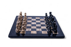 Chess set with black and white pieces on a checkered board