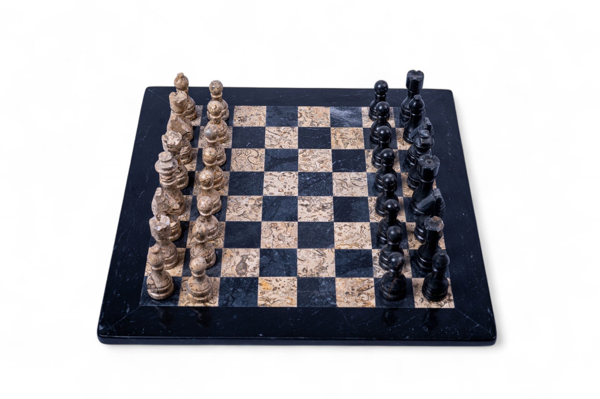 Chessboard with stone-like pieces on a white background