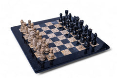 Black and beige stone chess set on a checkered board