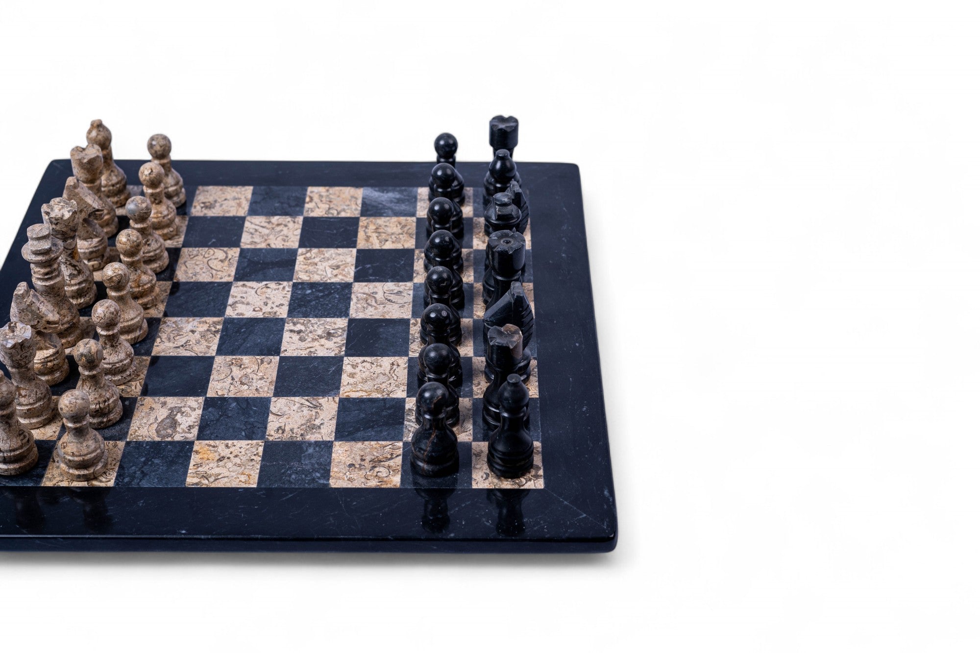 Chessboard with stone-like pieces on a white background