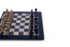 Chessboard with stone-like pieces on a white background