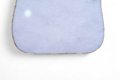 Light blue ceramic dish on a white background