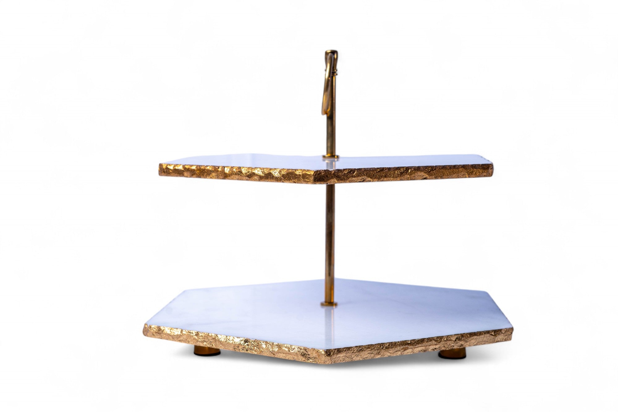 Two-tiered decorative stand with gold and white design on a white background
