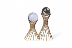 Decorative items with spherical tops and woven base on a white background